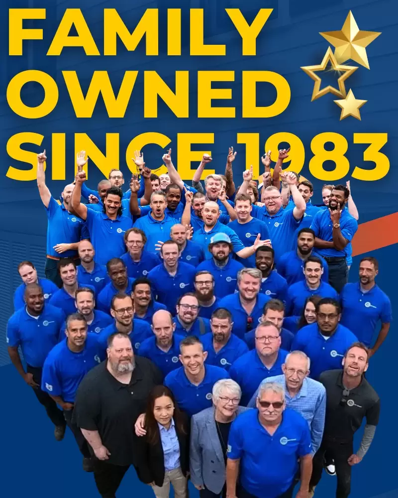 Group photo of employees from a family-owned HVAC company, established in 1983.